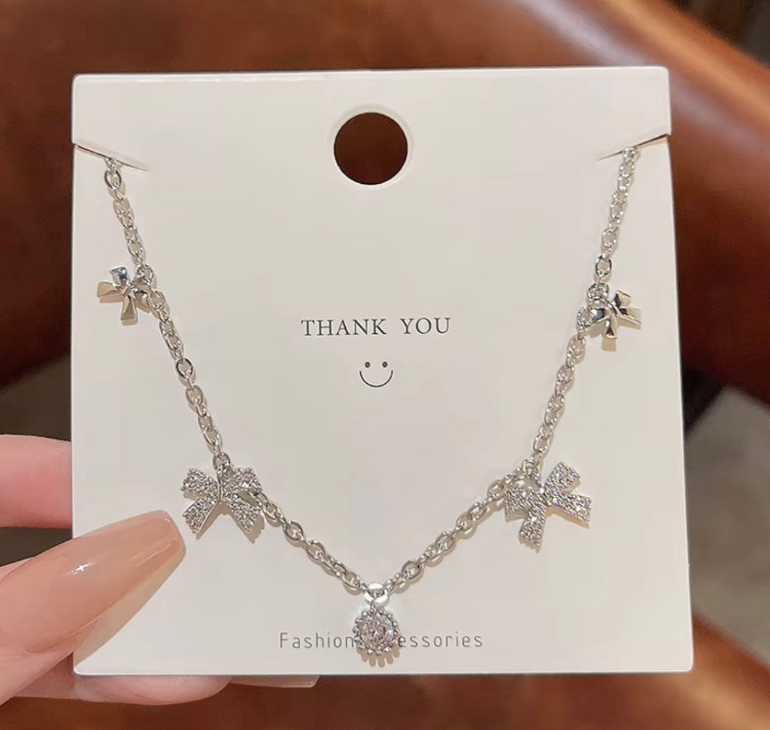 Silver ribbon rhinestone necklace – Scoopofjewels