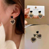 Black rhinestone heart earrings